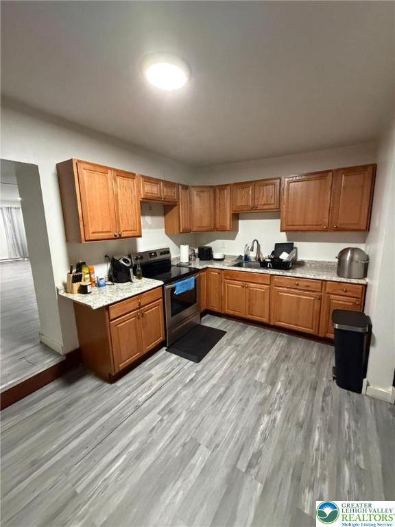 731 North Front Street Allentown, PA 18102 - Photo 7 of 22 a kitchen with stainless steel appliances granite countertop a sink counter space cabinets and a window