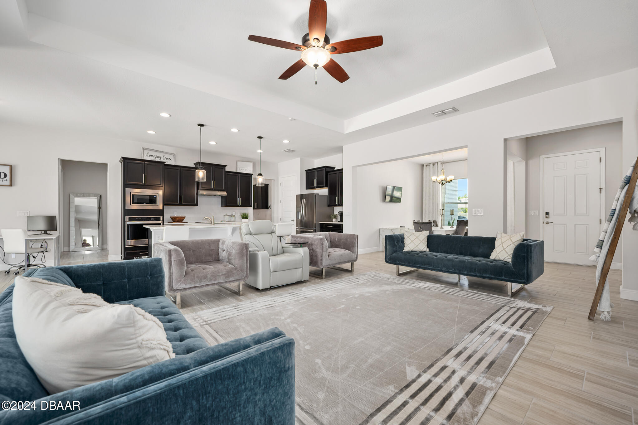295 Cypress Trail Drive Ormond Beach, FL 32174 - Photo 13 of 67 a living room with furniture kitchen view and a chandelier