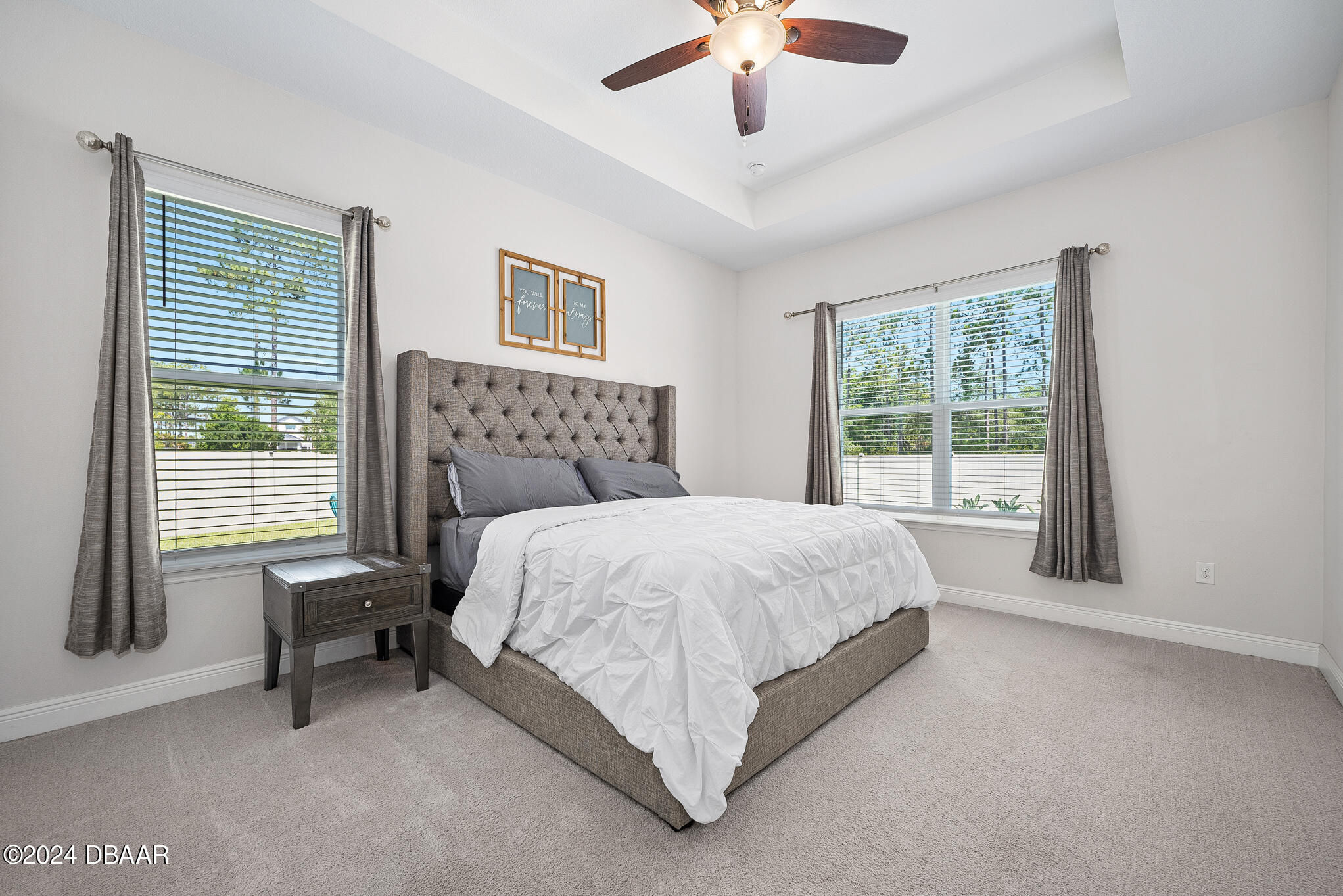 295 Cypress Trail Drive Ormond Beach, FL 32174 - Photo 14 of 67 a bed sitting in a bedroom next to a window