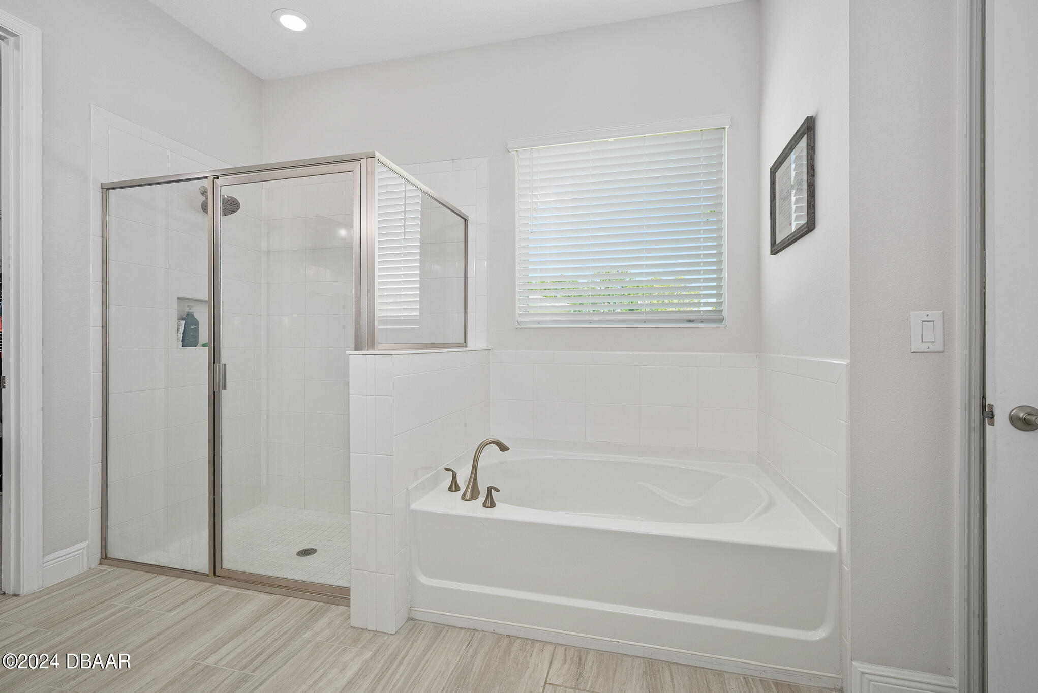 295 Cypress Trail Drive Ormond Beach, FL 32174 - Photo 18 of 67 a bathroom with a bathtub and a shower