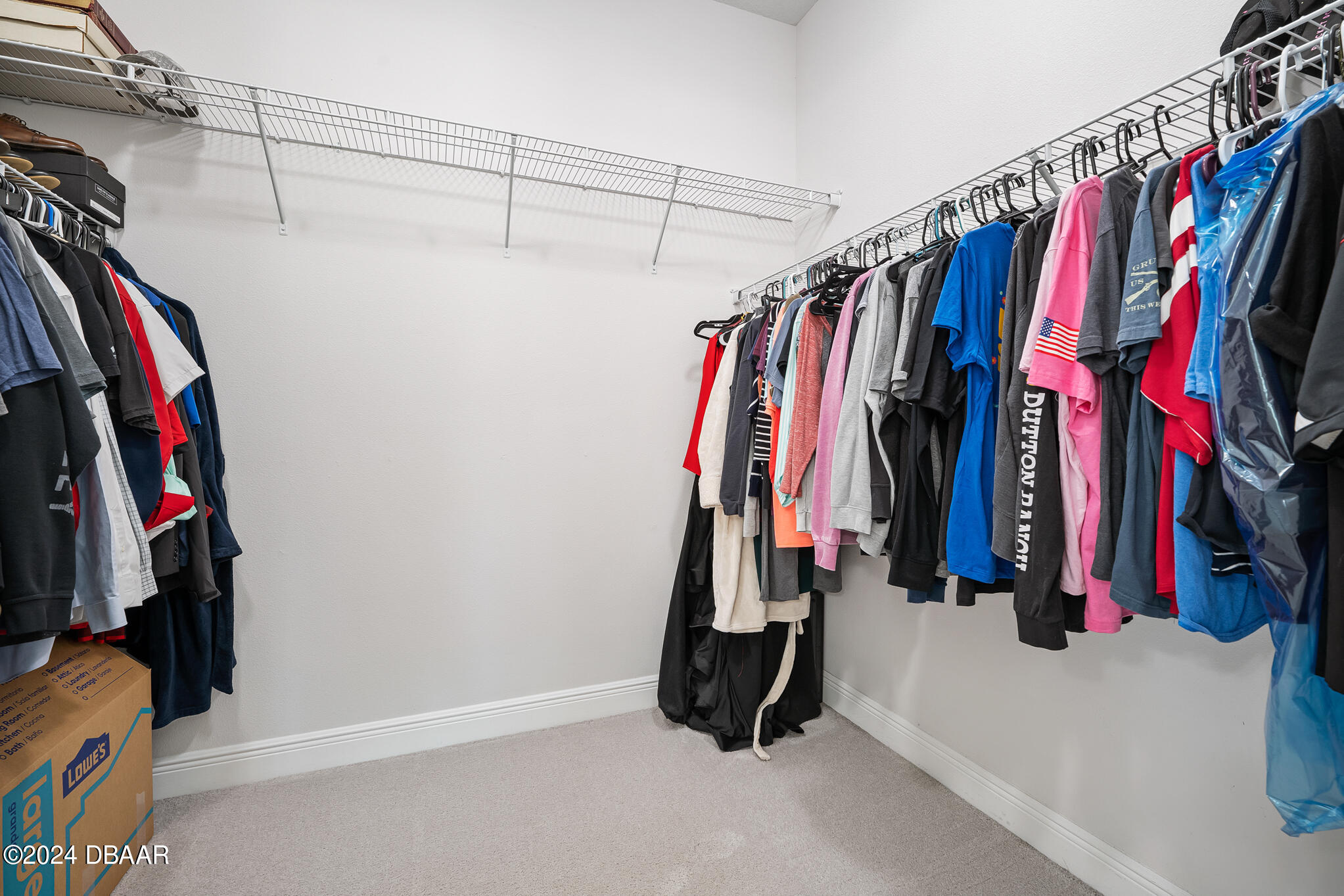 295 Cypress Trail Drive Ormond Beach, FL 32174 - Photo 19 of 67 a view of walk in closet with clothes