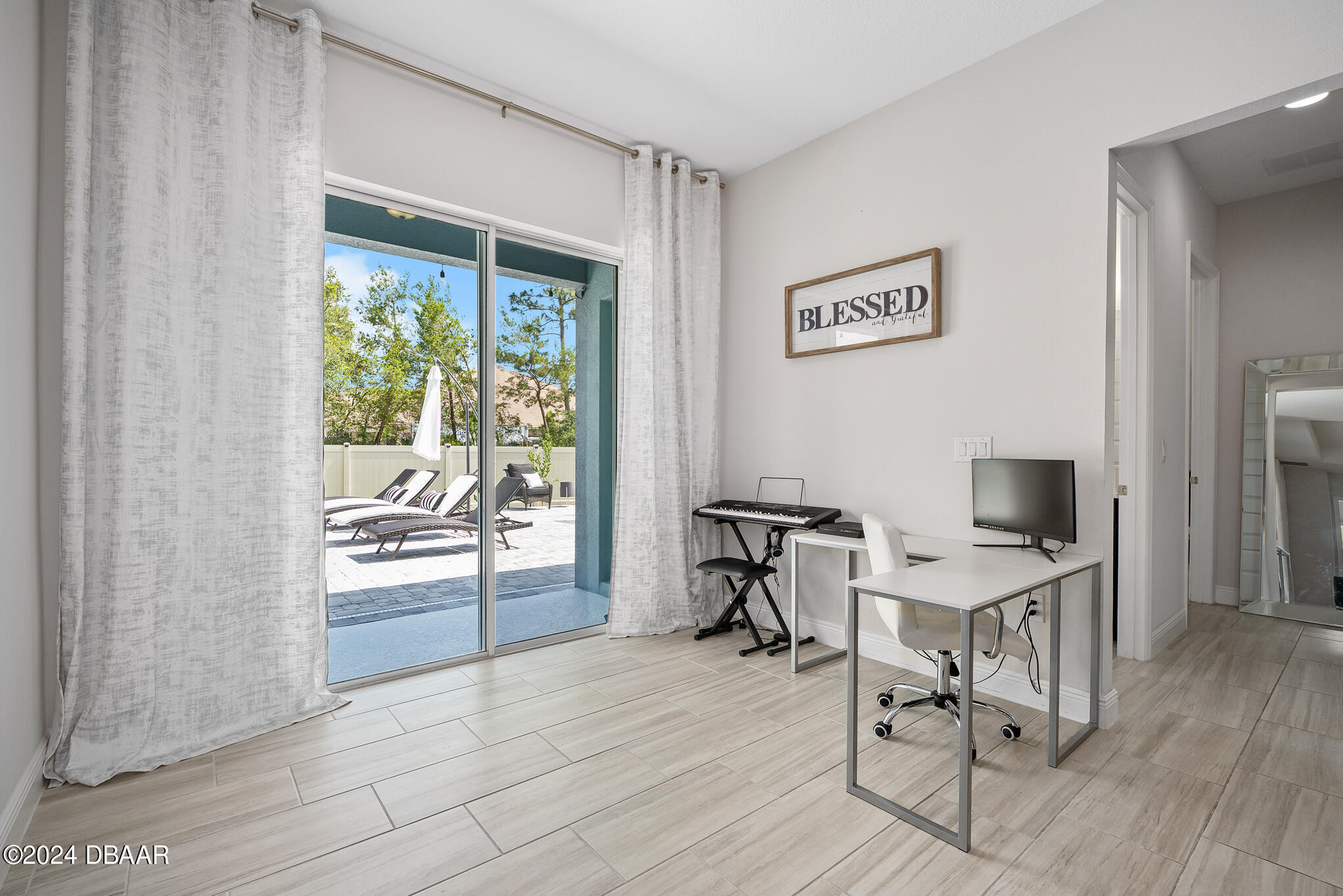295 Cypress Trail Drive Ormond Beach, FL 32174 - Photo 24 of 67 a workspace with wooden floor and a window
