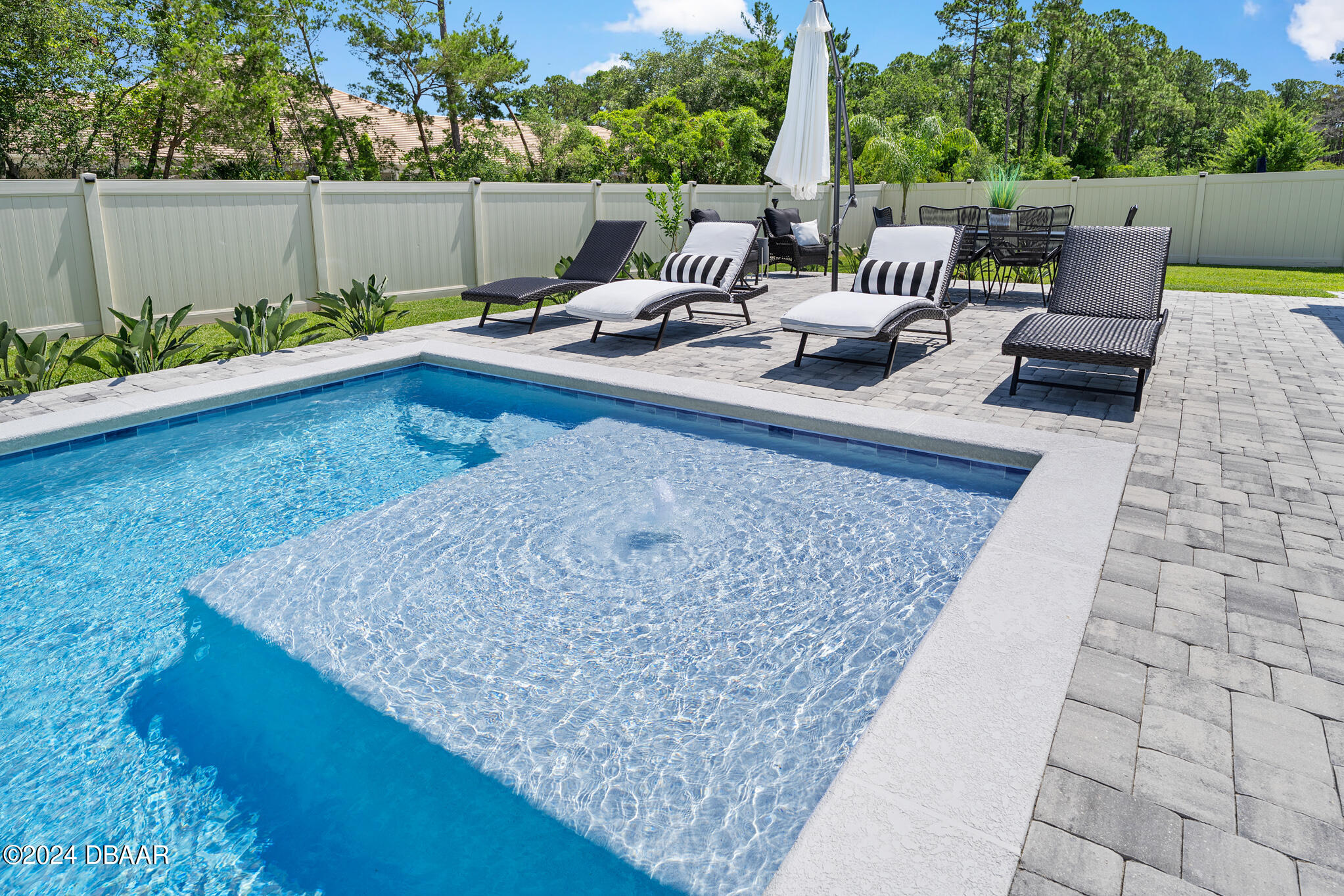 295 Cypress Trail Drive Ormond Beach, FL 32174 - Photo 32 of 67 swimming pool view with a seating space