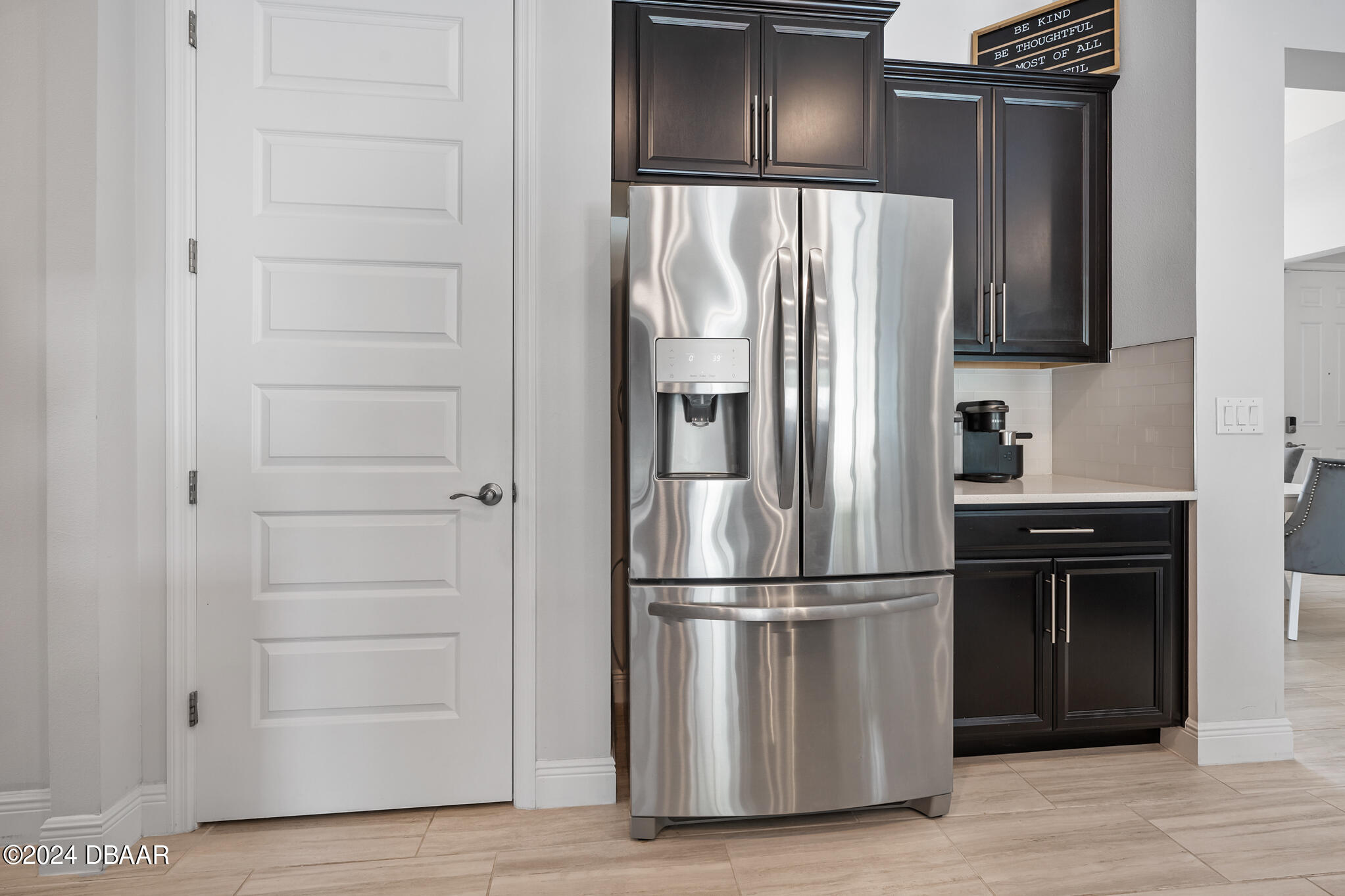 295 Cypress Trail Drive Ormond Beach, FL 32174 - Photo 40 of 67 a metallic refrigerator freezer sitting in a kitchen