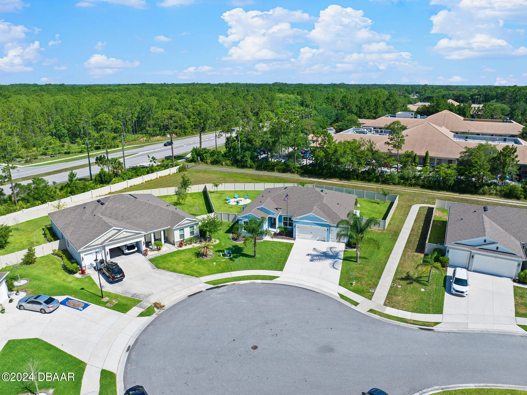 295 Cypress Trail Drive Ormond Beach, FL 32174 - Photo 53 of 67 an aerial view of a house with a garden and lake view