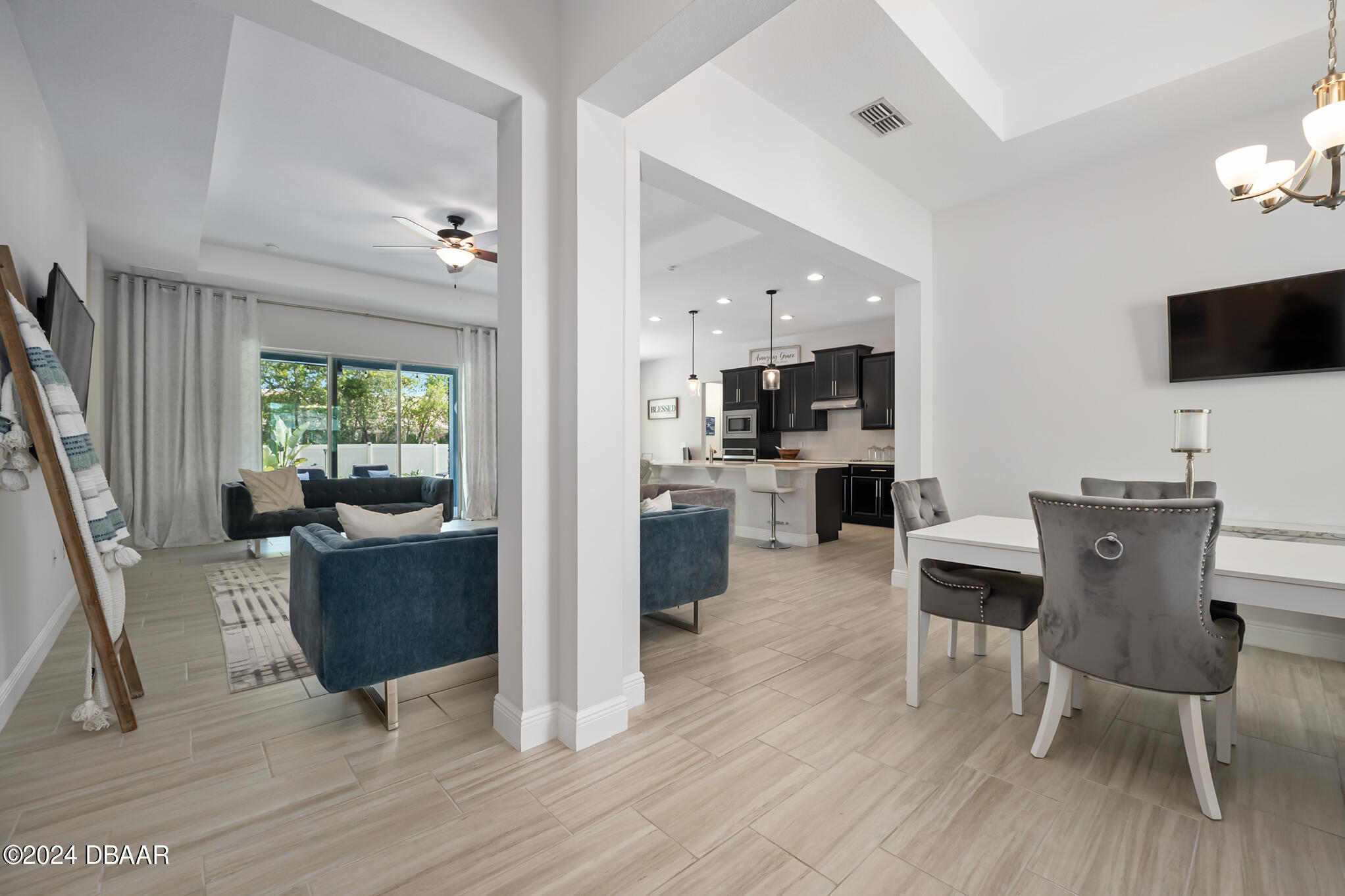 295 Cypress Trail Drive Ormond Beach, FL 32174 - Photo 8 of 67 a view of a dining room with furniture window and wooden floor