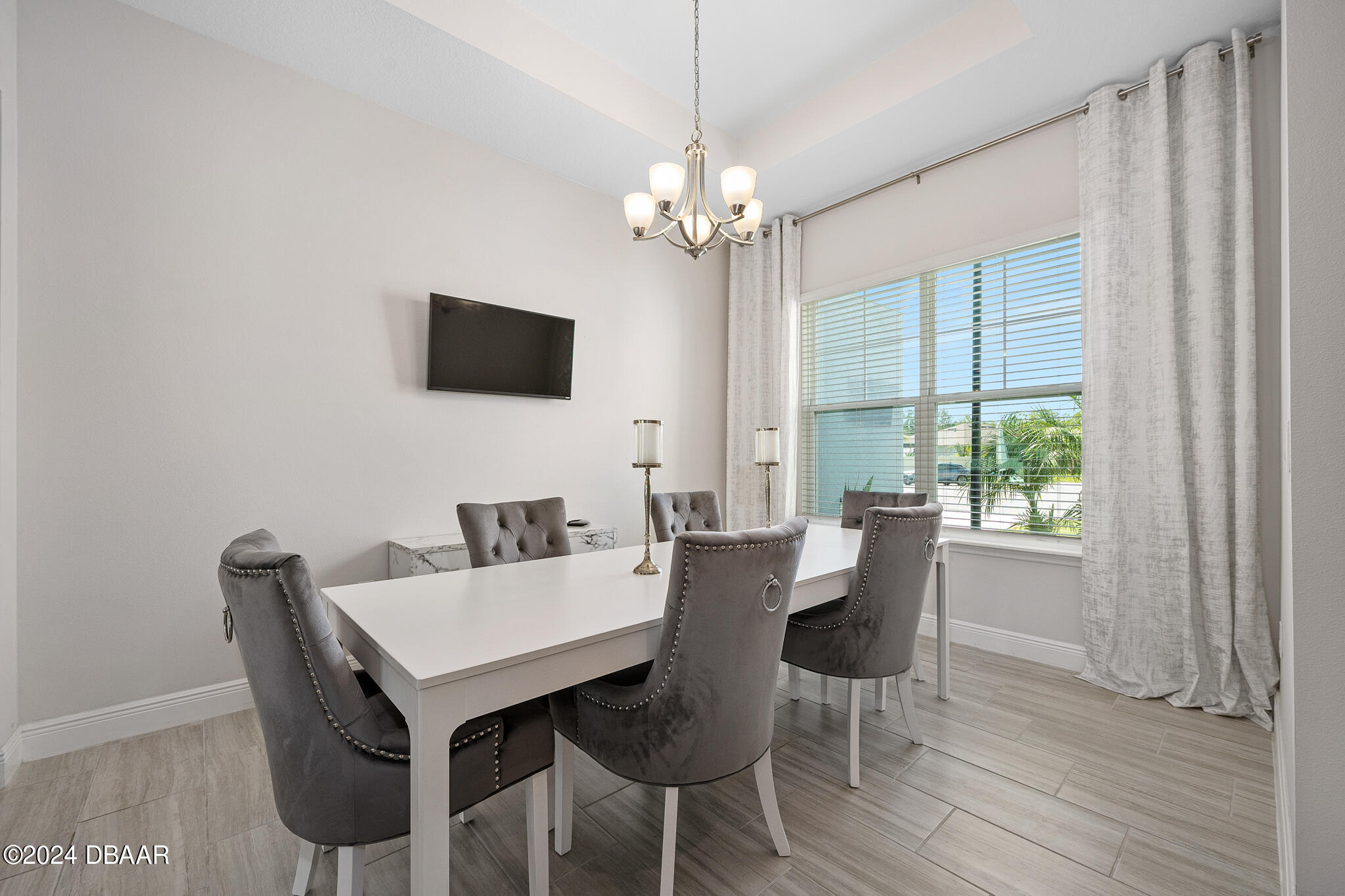 295 Cypress Trail Drive Ormond Beach, FL 32174 - Photo 10 of 67 a view of a dining room with furniture window and wooden floor