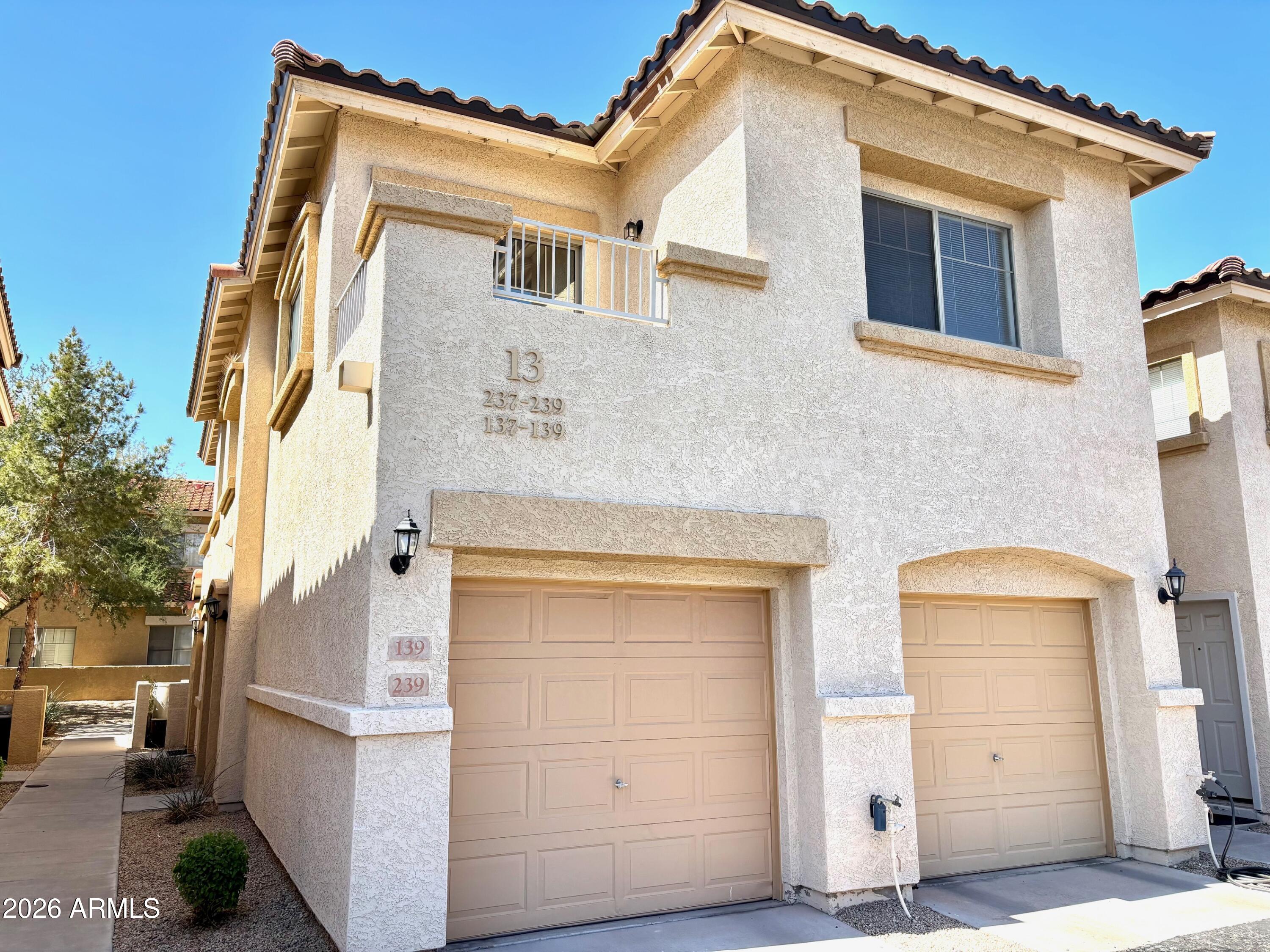 a front view of a house with parking