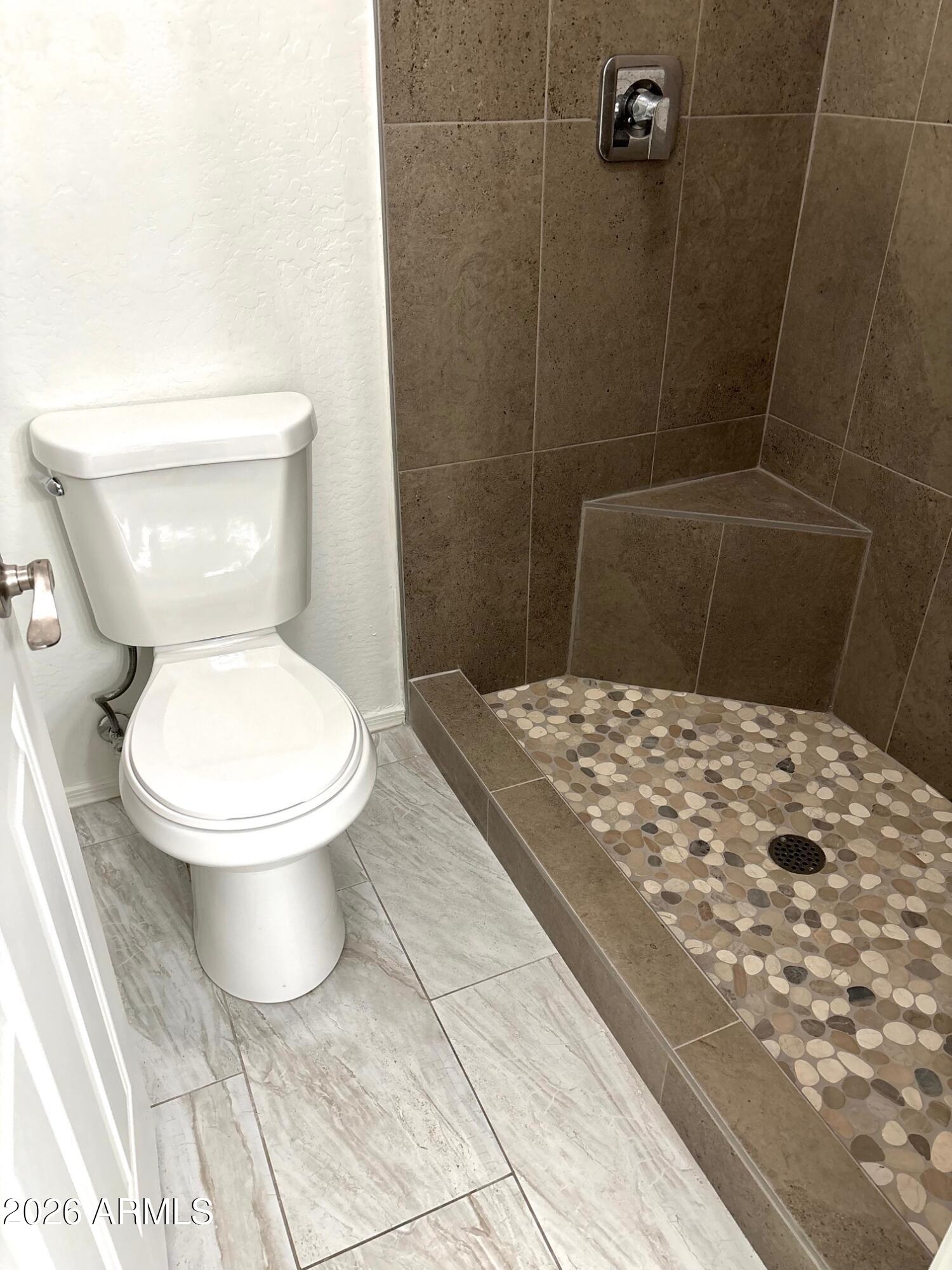 525 North Miller Road, Unit 239 Scottsdale, AZ 85257 - Photo 27 of 52 a bathroom with a toilet and a shower