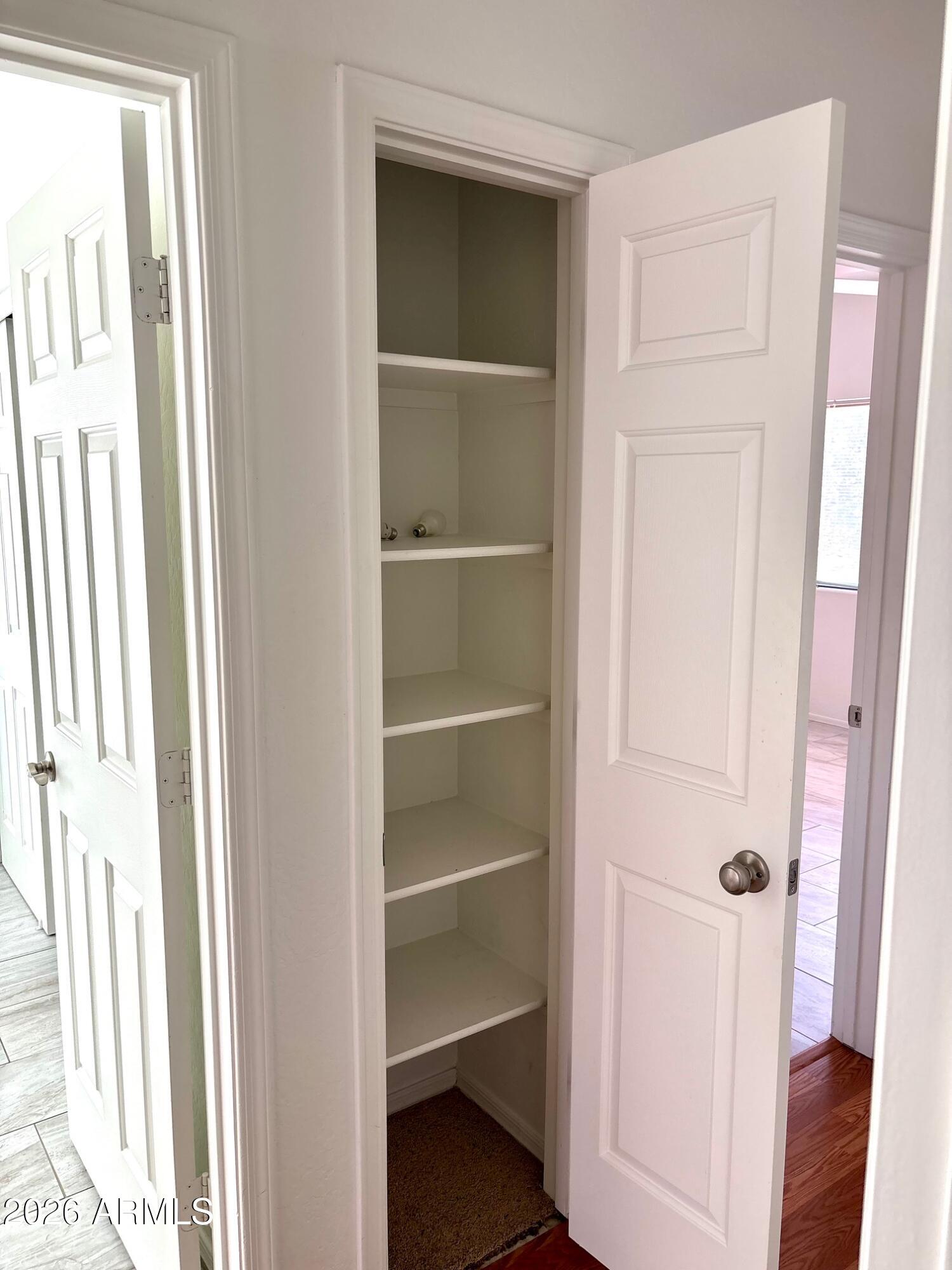 525 North Miller Road, Unit 239 Scottsdale, AZ 85257 - Photo 33 of 52 a view of walk in closet with empty racks