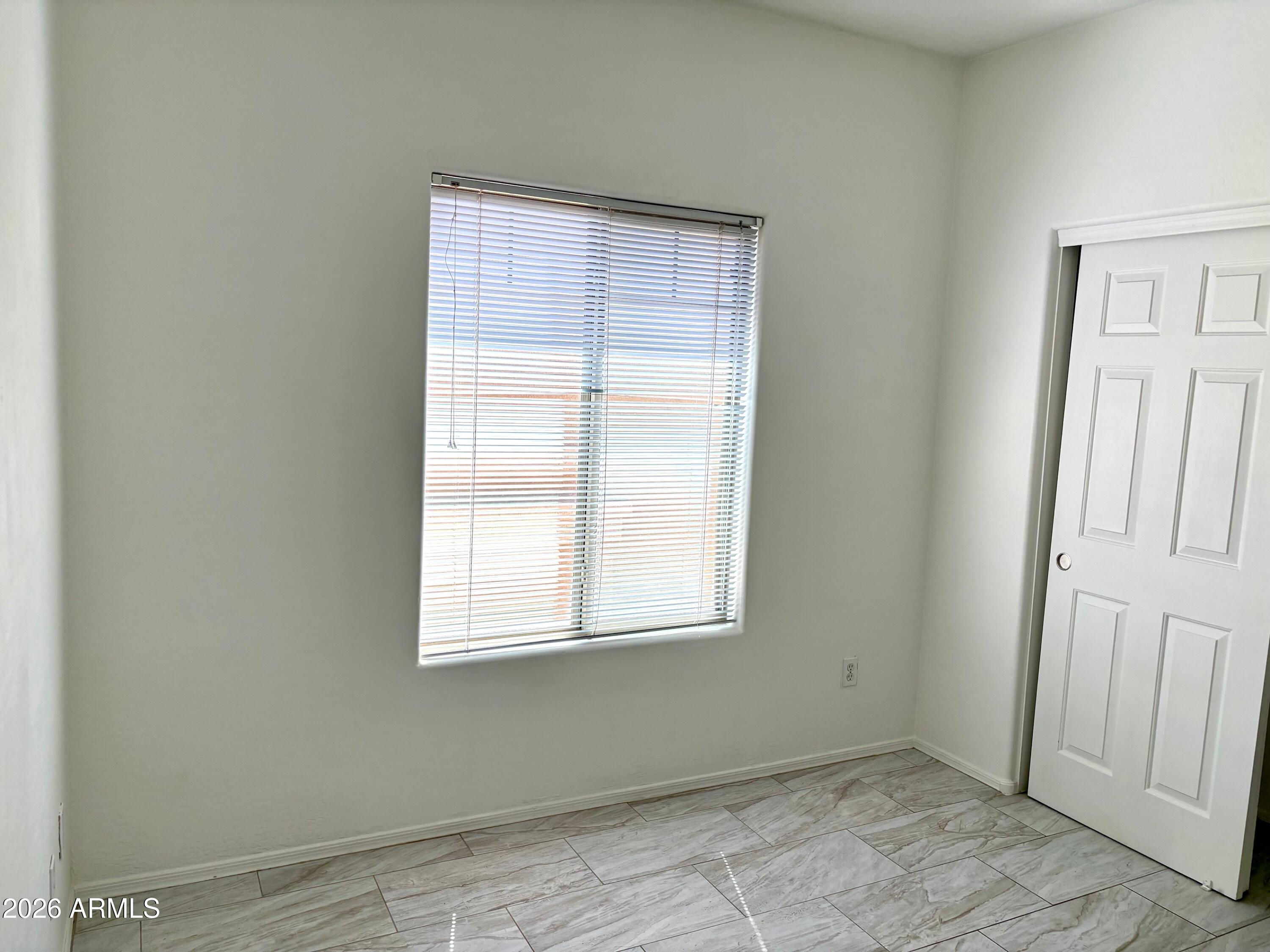 525 North Miller Road, Unit 239 Scottsdale, AZ 85257 - Photo 35 of 52 an empty room with windows
