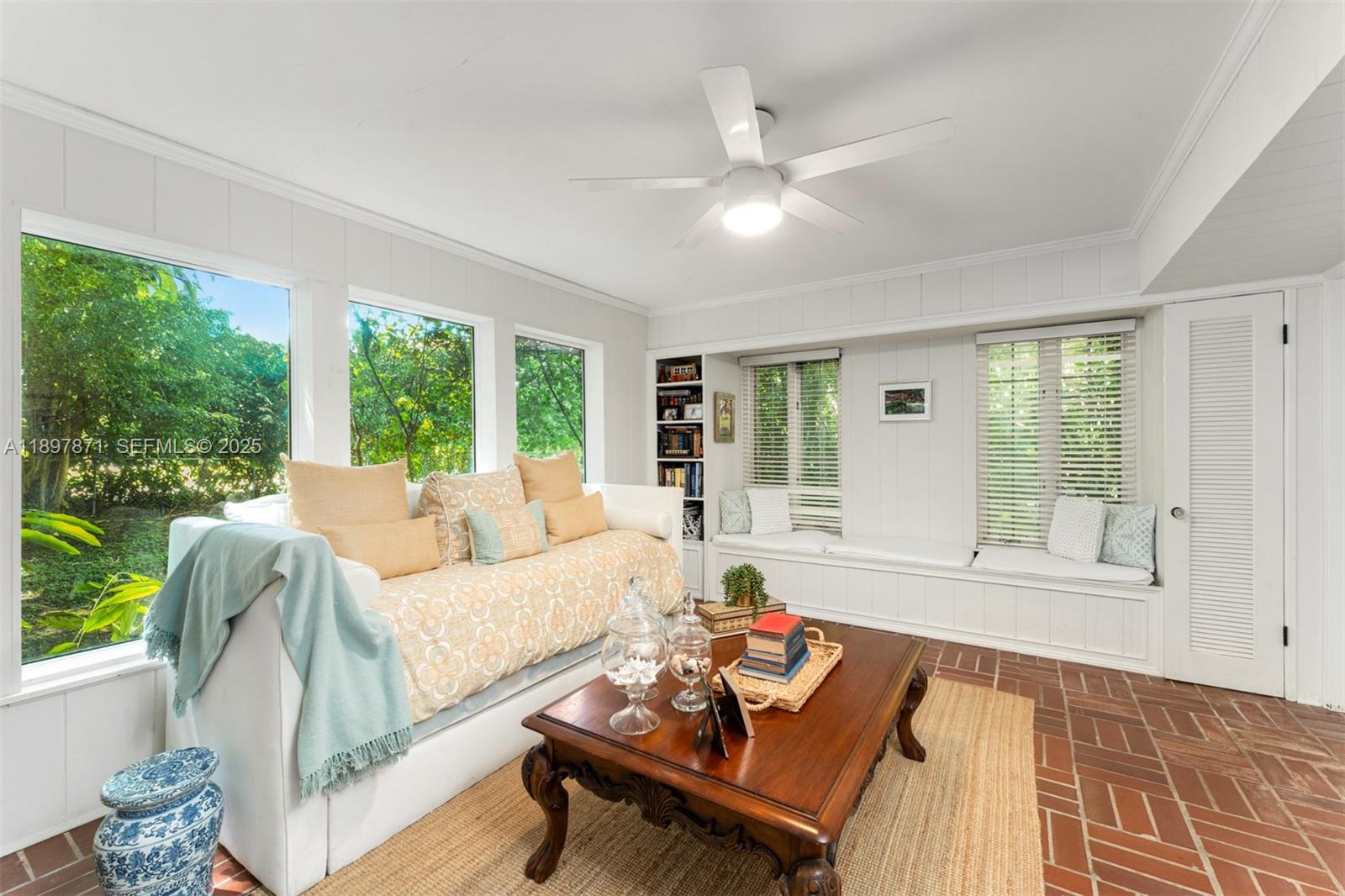 5950 Southwest 128th Street Pinecrest, FL 33156 - Photo 14 of 37 a living room with furniture and a large window