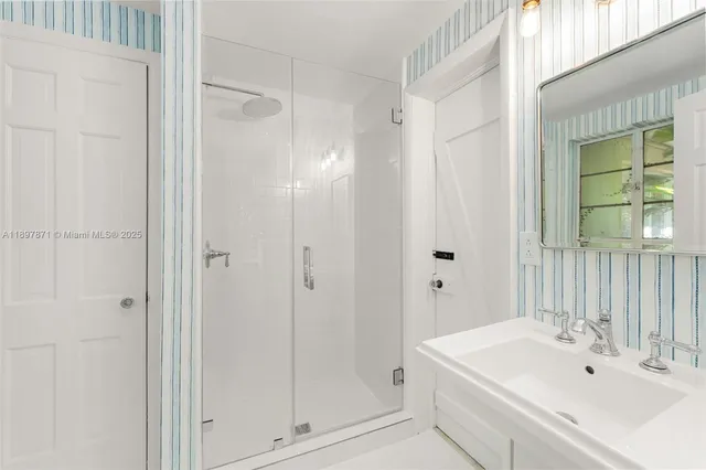 a living room with furniture and flowers