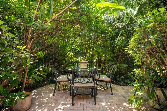 a bed room with a bed and a chandelier