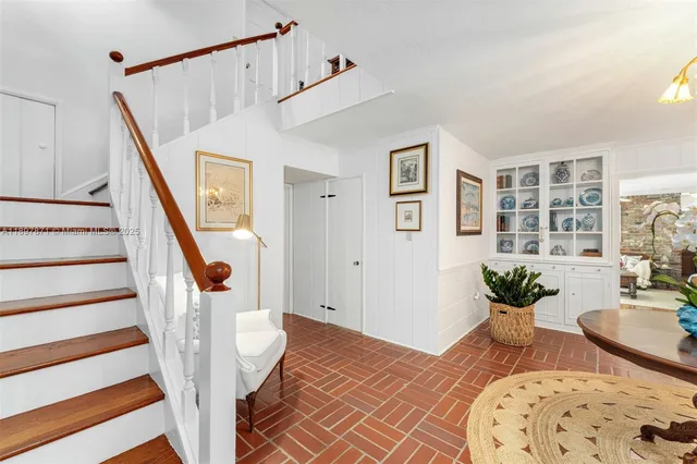a bathroom with a sink a mirror and shower