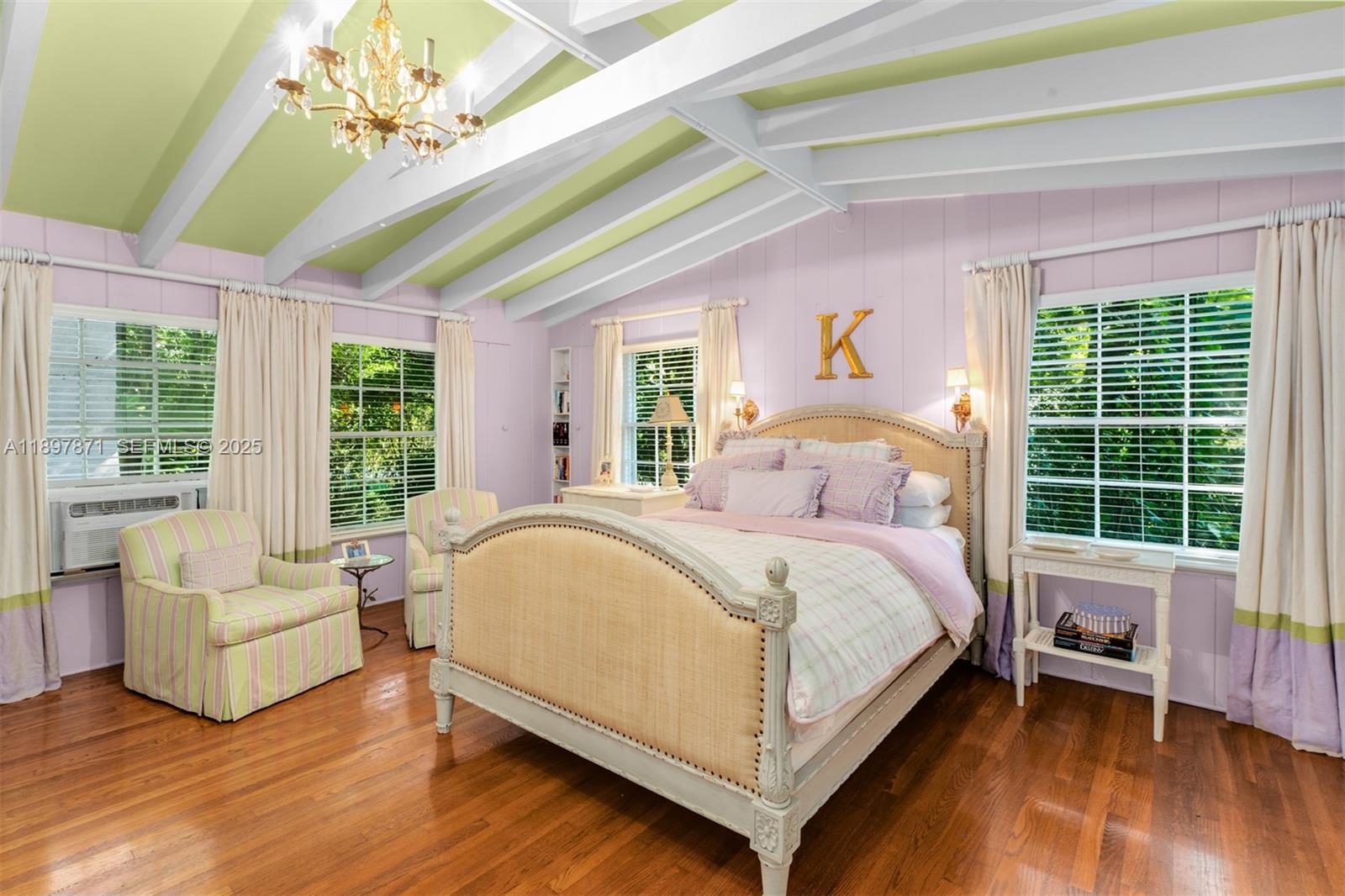 5950 Southwest 128th Street Pinecrest, FL 33156 - Photo 23 of 37 a bedroom with a large bed and a large window
