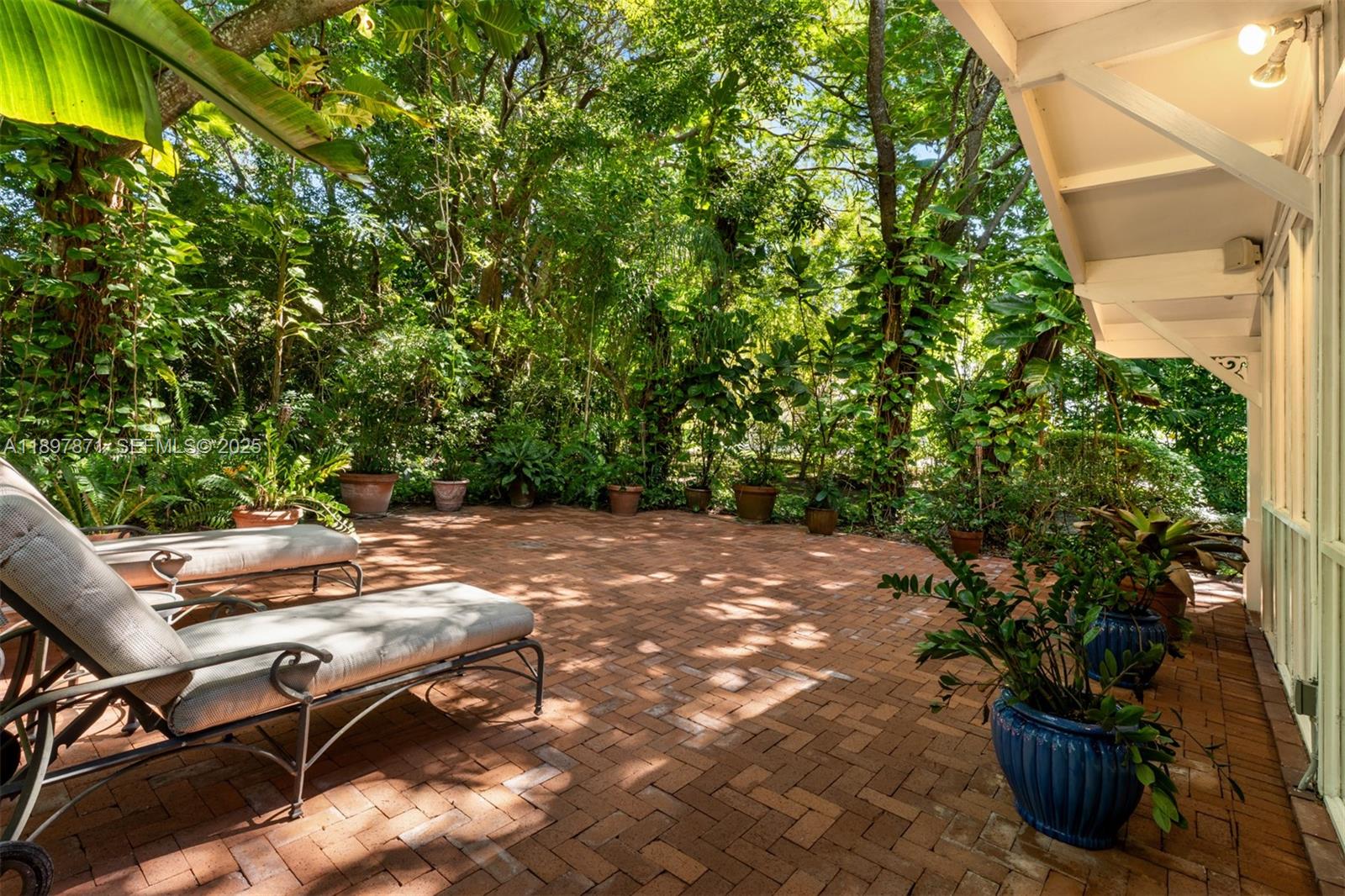 5950 Southwest 128th Street Pinecrest, FL 33156 - Photo 28 of 37 a view of backyard with seating space