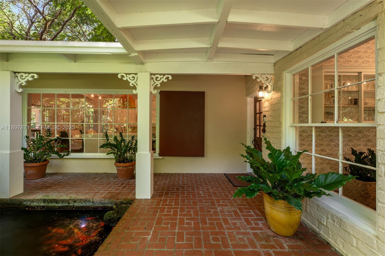 5950 Southwest 128th Street Pinecrest, FL 33156 - Photo 3 of 37 a view of a entryway door front of house