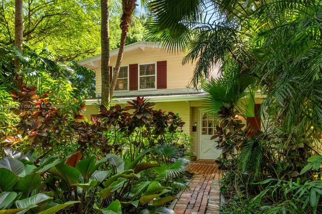 an aerial view of houses with yard