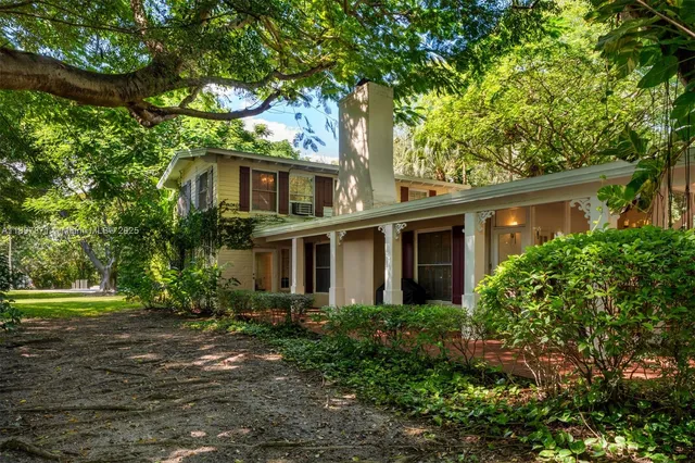 a view of a tree with a yard