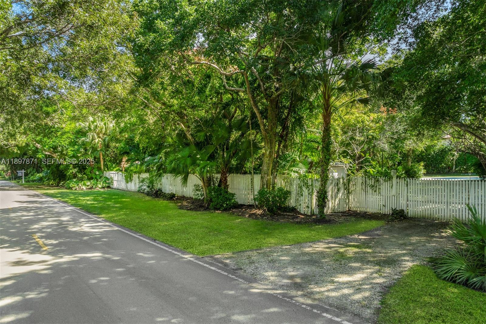 5950 Southwest 128th Street Pinecrest, FL 33156 - Photo 35 of 37 a view of a yard with a large trees