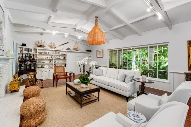 a view of a livingroom with furniture and a potted plant