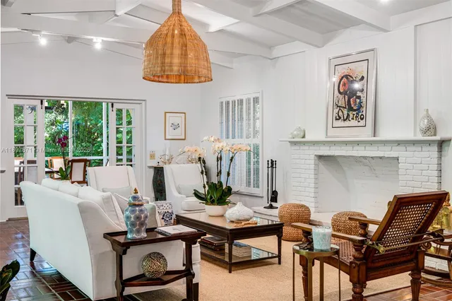 a view of a dining room with furniture large windows and wooden floor