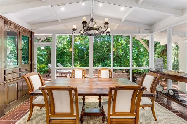 a view of a dining room with furniture window and outside view