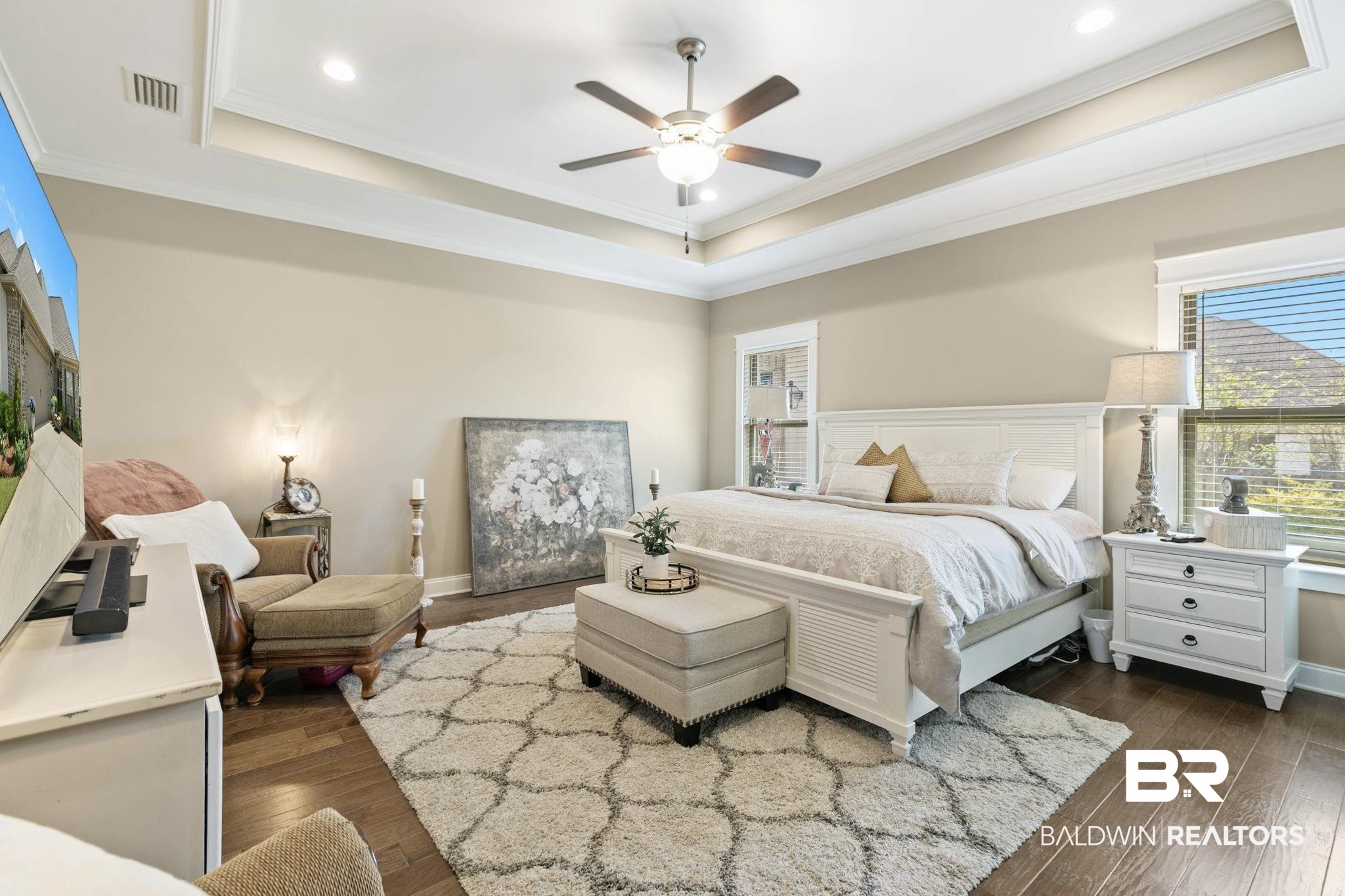 291 Hemlock Drive Fairhope, AL 36532 - Photo 28 of 65 Bedroom with dark wood-type flooring, a raised ceiling, crown molding, and a ceiling fan