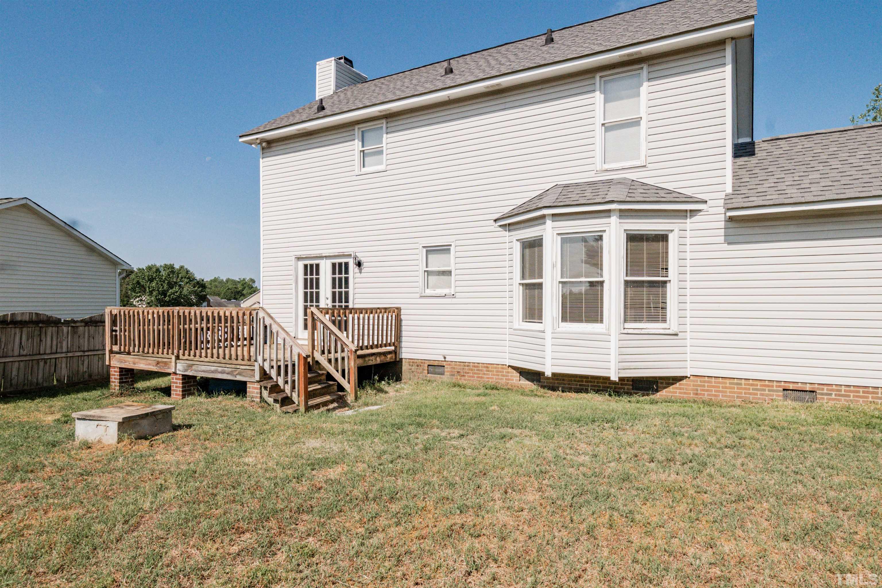 99 Windsor Drive Angier, NC 27501 - Photo 19 of 21 a house view with a backyard space
