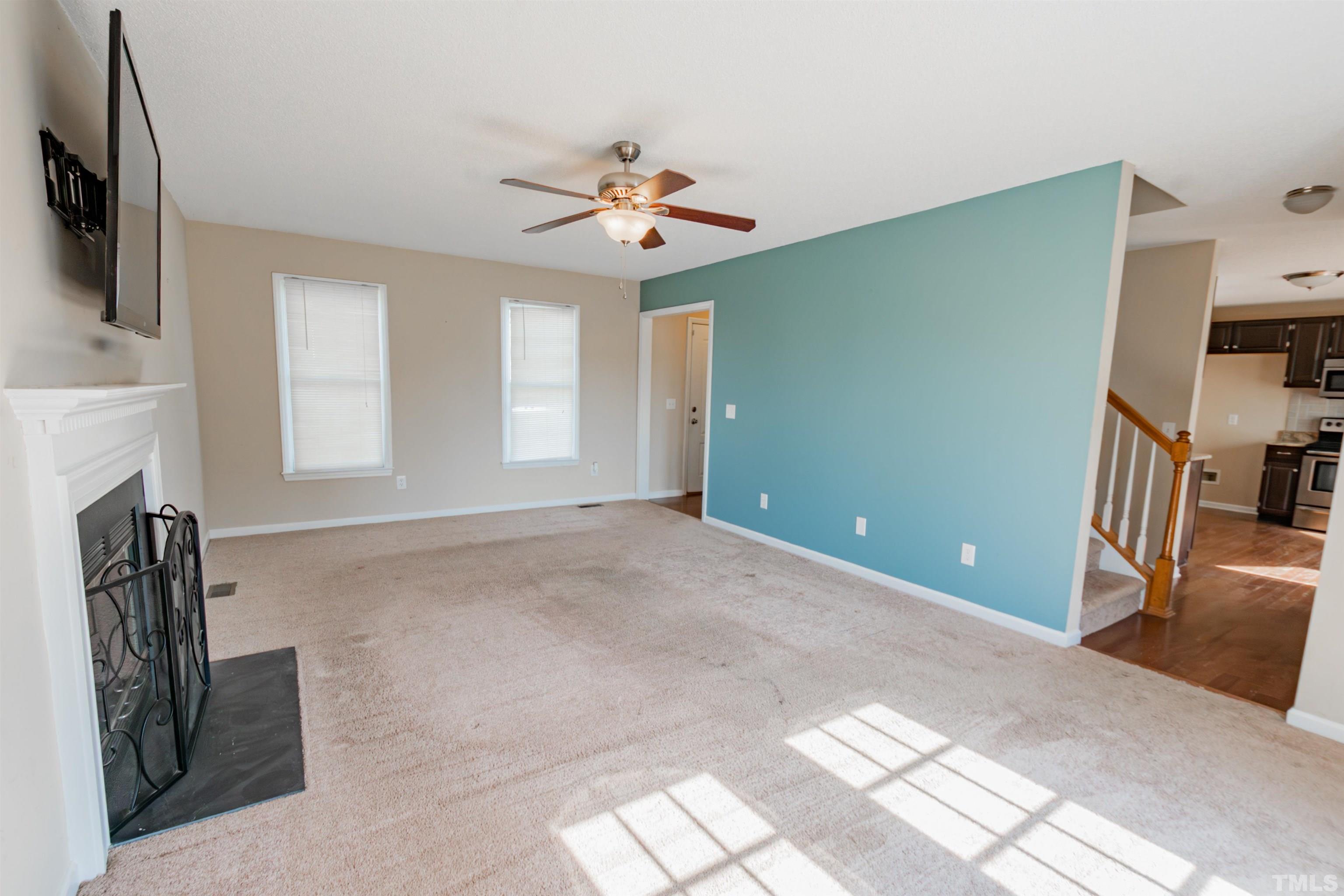 99 Windsor Drive Angier, NC 27501 - Photo 4 of 21 a view of livingroom with hardwood floor and a ceiling fan