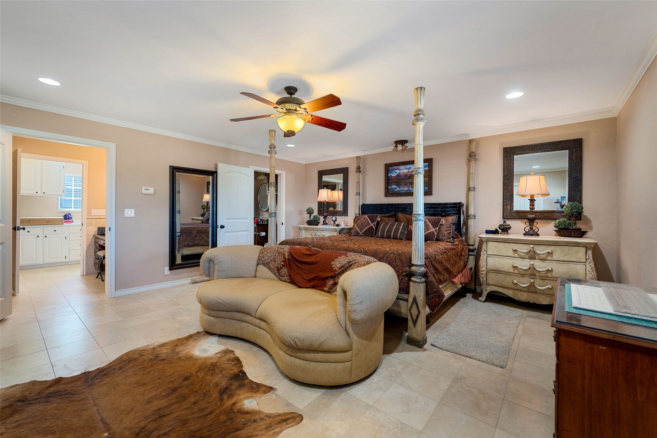 7702 Ranch Road 965 Llano, TX 78643 - Photo 17 of 40 a bedroom with furniture and a chandelier