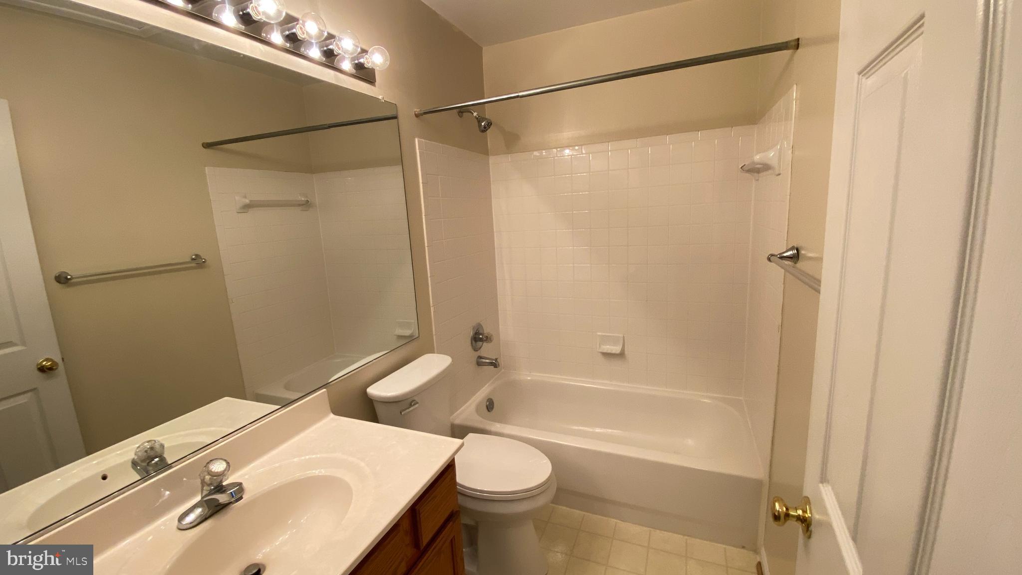 8231 Ramseur Place Manassas, VA 20109 - Photo 13 of 16 a bathroom with a sink toilet and shower