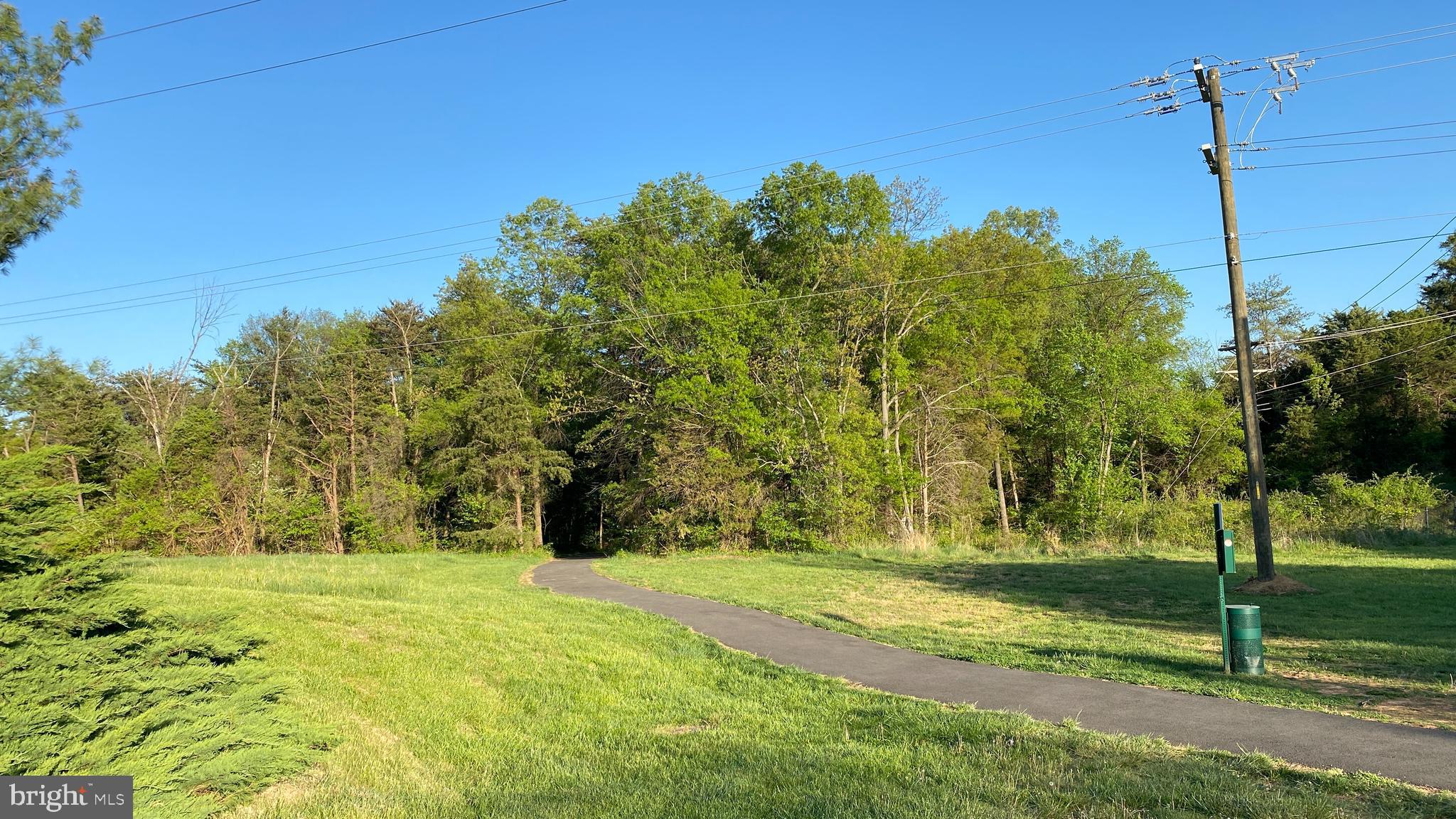 8231 Ramseur Place Manassas, VA 20109 - Photo 16 of 16 a yellow house with trees in front of it