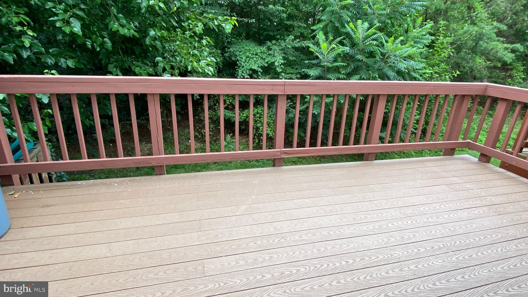8231 Ramseur Place Manassas, VA 20109 - Photo 5 of 16 a view of wooden deck and a yard