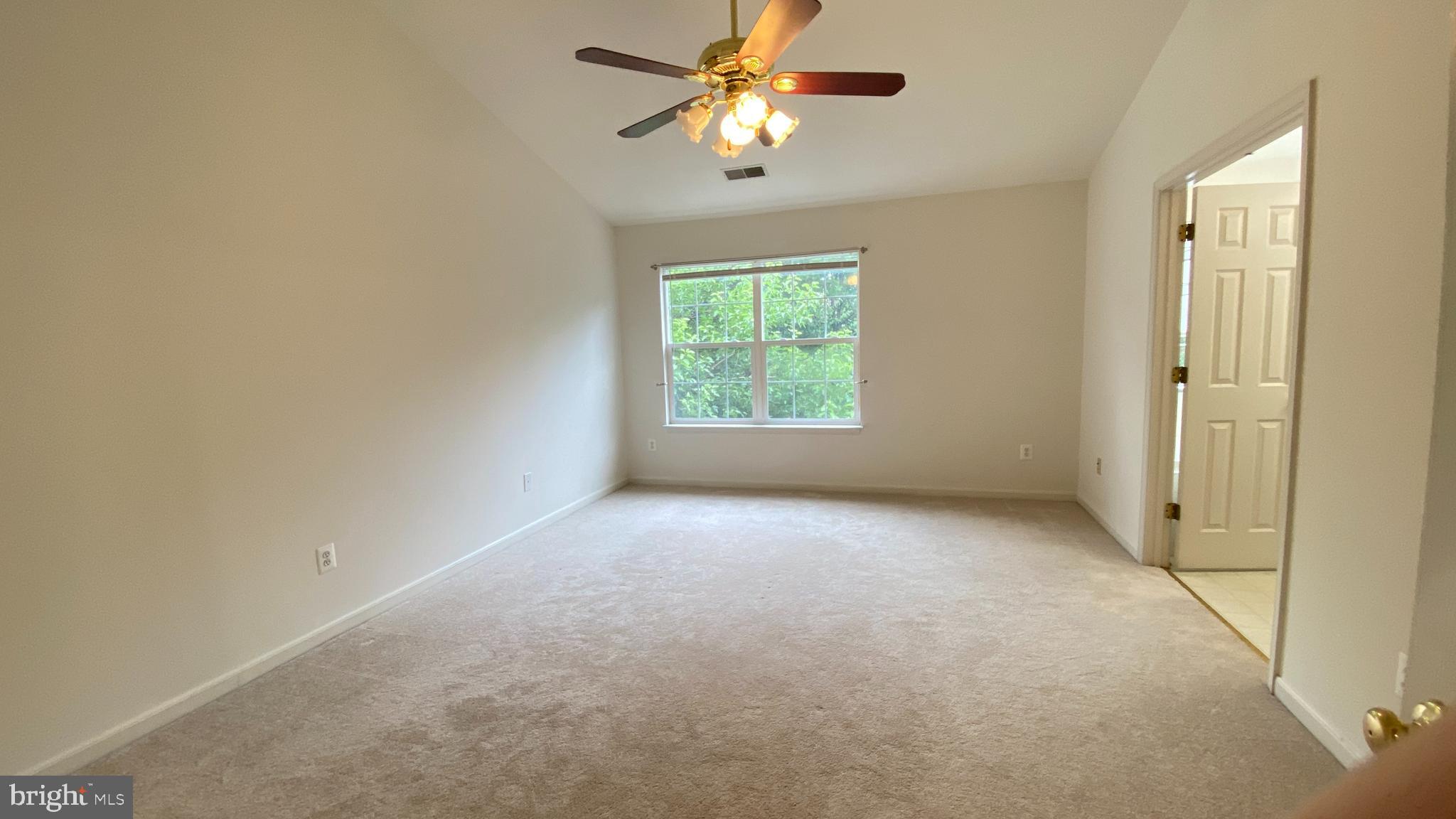 8231 Ramseur Place Manassas, VA 20109 - Photo 6 of 16 wooden floor in an empty room with a window