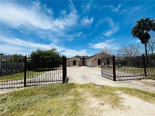 a view of a wrought iron fences in front of house