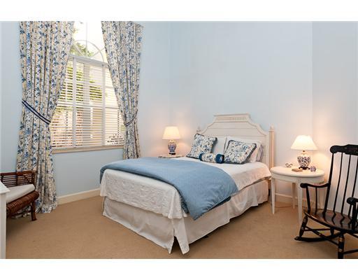 6329 Northwest 23rd Way Boca Raton, FL 33496 - Photo 8 of 10 a bedroom with a bed and a window