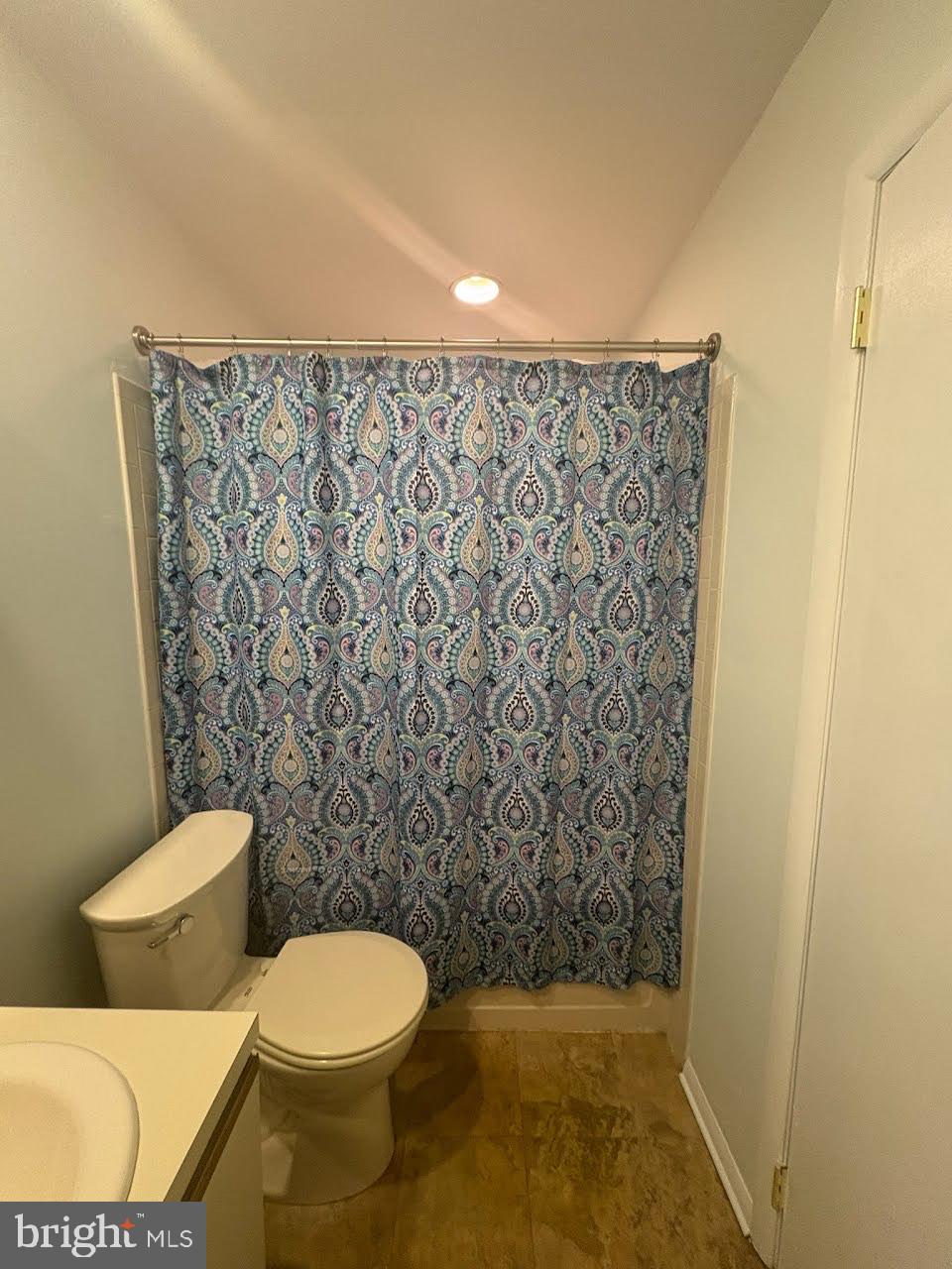 614 Augusta Circle Mount Laurel, NJ 08054 - Photo 6 of 10 a bathroom with a toilet and a shower curtain