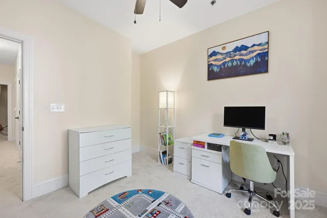 a view of a workspace with furniture