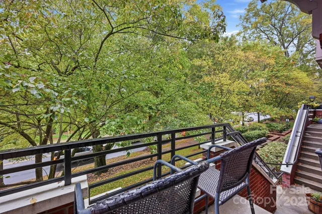 a view of a balcony with chairs