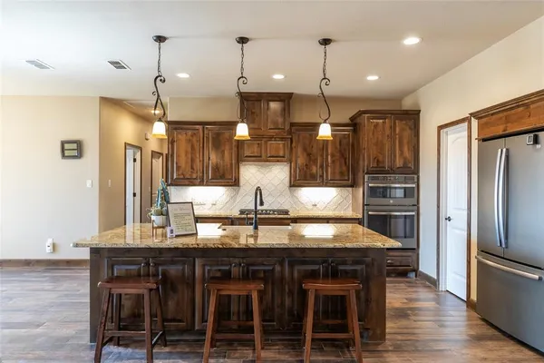 a kitchen with a table and chairs in it
