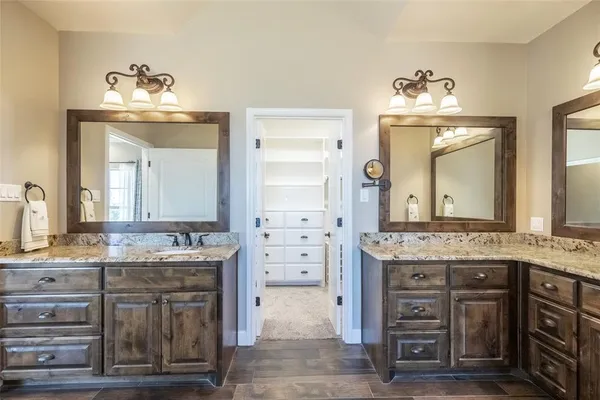 a bathroom with a sink double vanity and a mirror