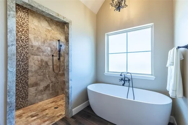 a white bath tub sitting next to a window