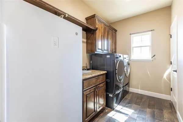a view of a storage and utility room with washer and dryer