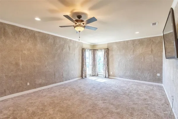 a view of an empty room with a window