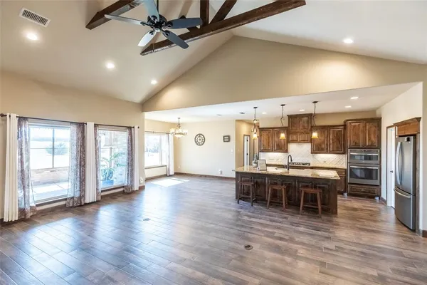 a view of a kitchen and dining room