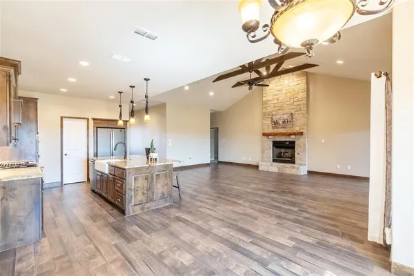 a view of kitchen with furniture and wooden floor