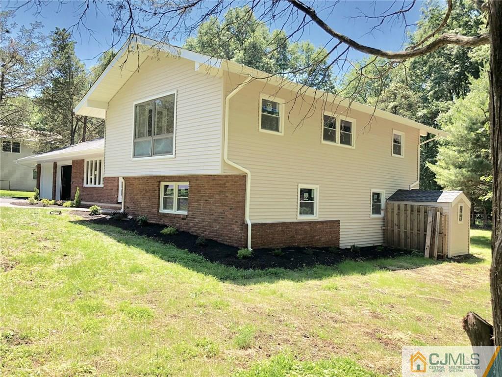 738 West Foothill Road Bridgewater, NJ 08807 - Photo 5 of 22 a view of a house with backyard and sitting area