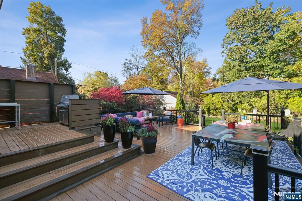 398 Grove Street Montclair, NJ 07043 - Photo 28 of 48 a backyard of a house with barbeque oven table and chairs